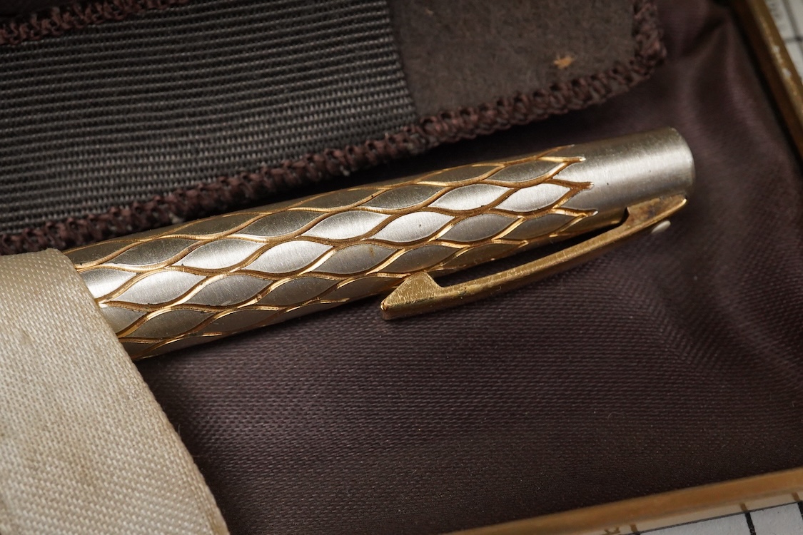 A folder of Parker and Sheaffer pens and ball pens, mostly boxed and a Parker Pen box containing eight items